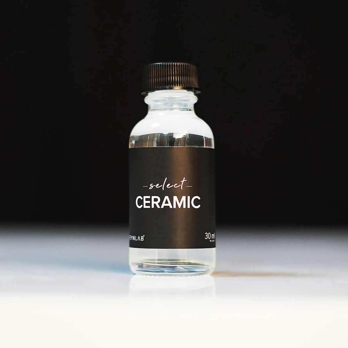 Bottle of ceramic coating on a dark background