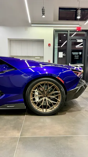 Bronze rear wheel and glossy purple fender of a Lamborghini Revuelto after a detail and polish for Lamborghini Sarasota