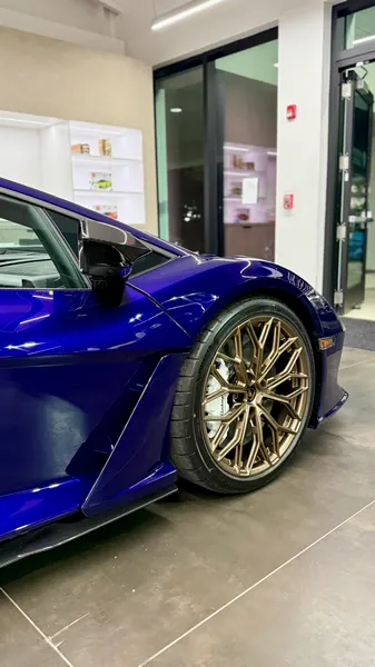 Bronze front wheel and polished purple paint on a Lamborghini Revuelto, detail and polish for Lamborghini Sarasota