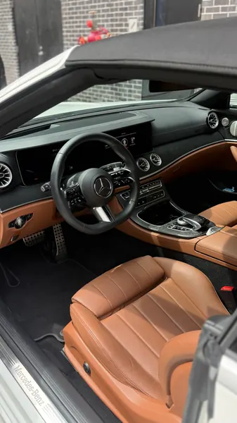 Clean tan leather interior of a Mercedes-Benz convertible, ceramic coating client in Sarasota