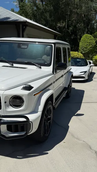 White Mercedes-Benz G-Class on a driveway