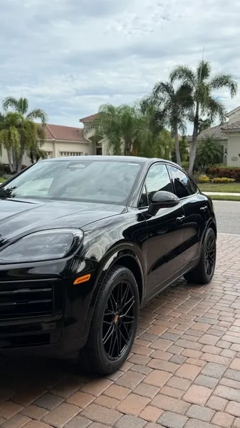 Black Porsche Cayenne Coupe front three-quarter view